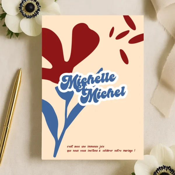 Faire-part de mariage illustré d’une anémone rouge sur fond crème, ambiance poétique et contrastée avec une touche romantique.