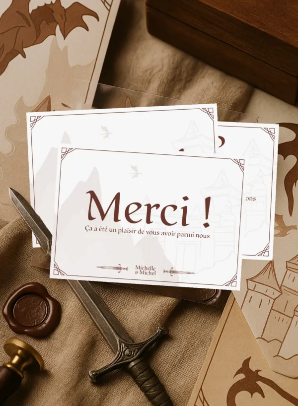 Carte de remerciement mariage fantasy avec "Merci", château, montagnes, dragon et épées croisées en fond.
